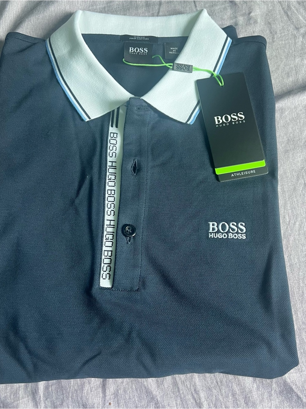 Hugo Boss Navy Polo slim fit with White Contrast Collar made from puma cotton